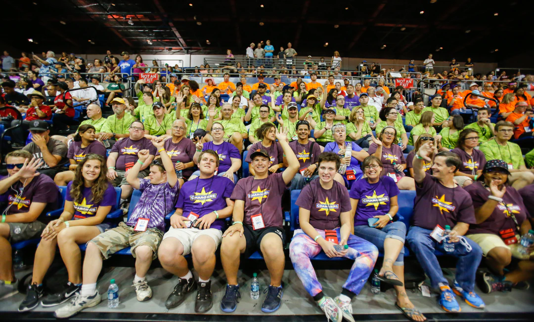 Crowd smiling at a sports game