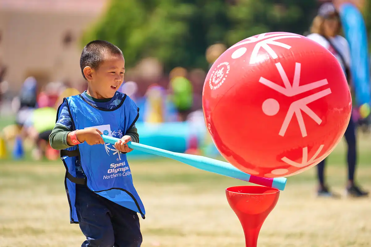 Young Athletes Fair - Boy Playing with Red Balloon